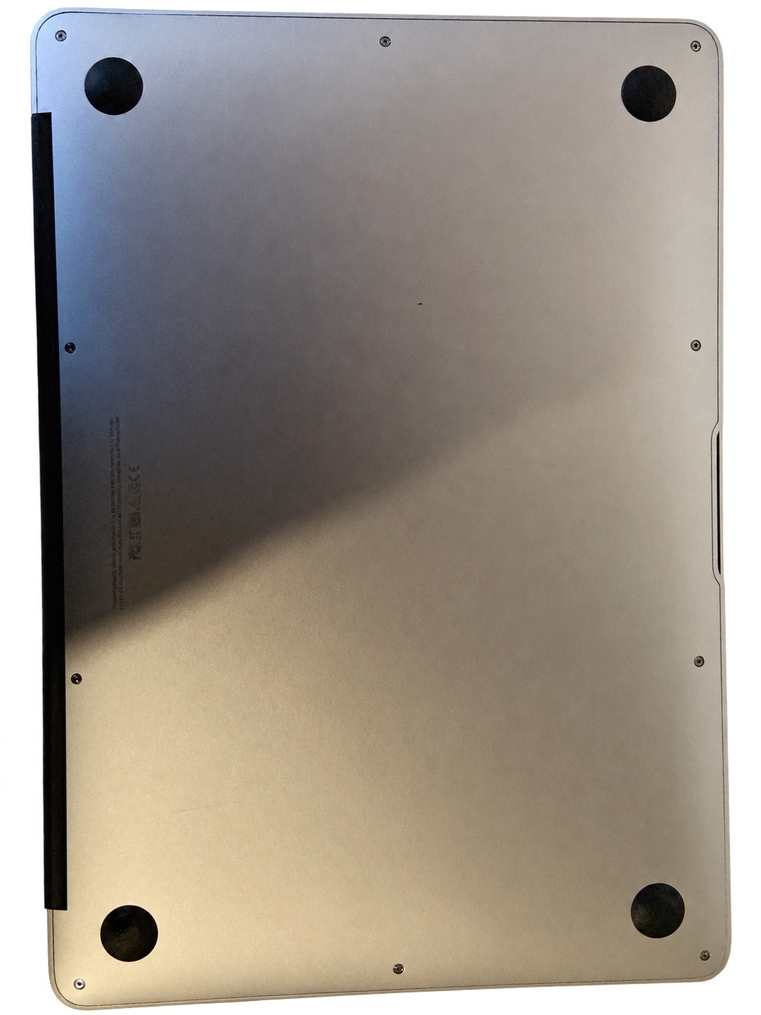 Actual Apple MacBook Air 13.3-inch 2015 underside condition on white background