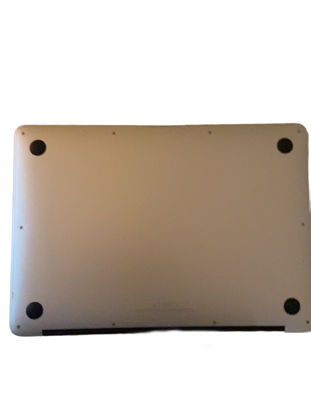 Actual Apple MacBook Air 13.3-inch 2017 underside condition on white background